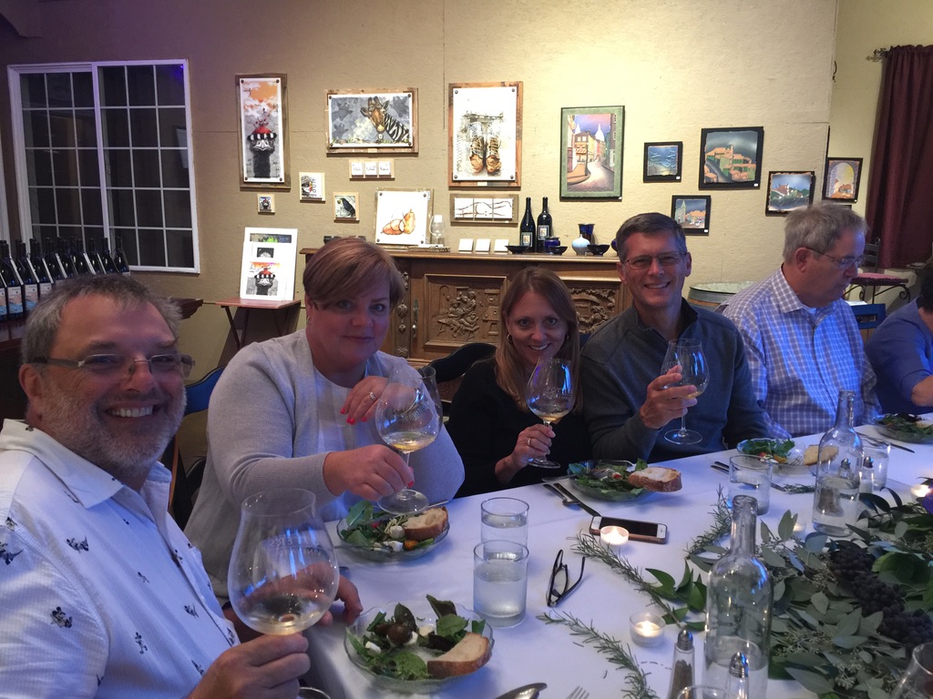 Guests enjoying a glass of white wine